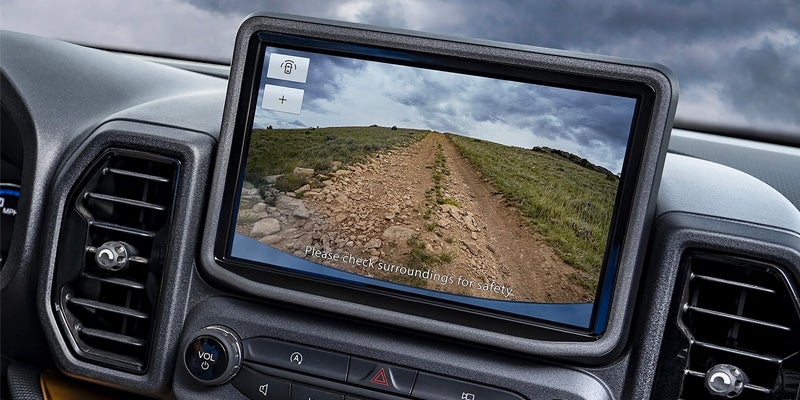 A view of the large infotainment system in the 2024 Ford Bronco Sport with the rear back up camera displayed on the screen
